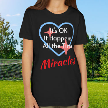 Bella+Canvas youth unisex t-shirt with “Miracles Happen” design and uplifting message, Christian apparel made from soft cotton, ideal for active kids and faith-inspired everyday wear, girl in black t-shirt